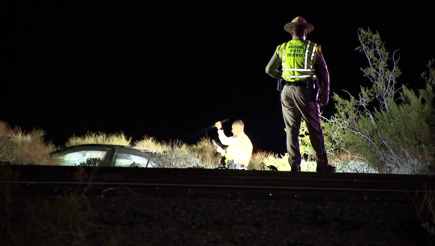 Woman dies after tractor-trailer hits stationary car on I-10