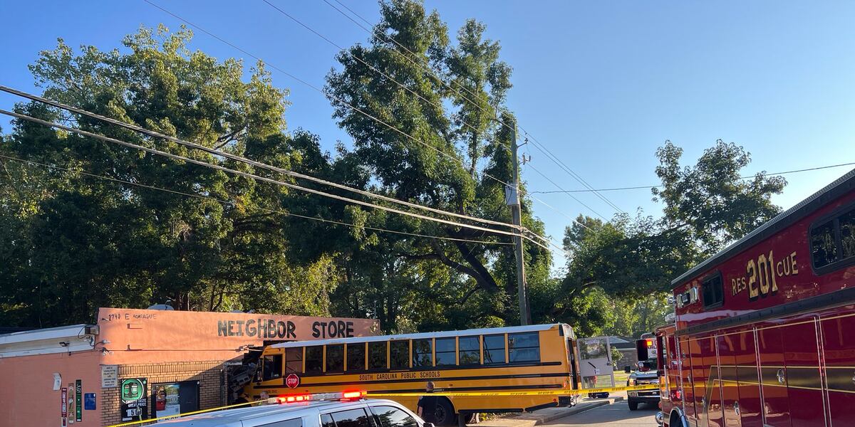 Official: School bus hits student, crashes into building