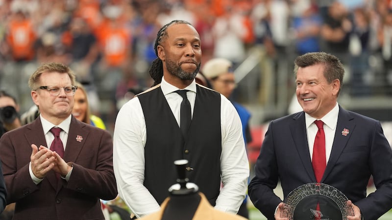 Former Arizona Cardinals wide receiver Larry Fitzgerald looks on during his Ring of Honor...