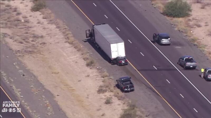 A car became wedged underneath a semi following a collision on westbound I-10 in Tonopah.