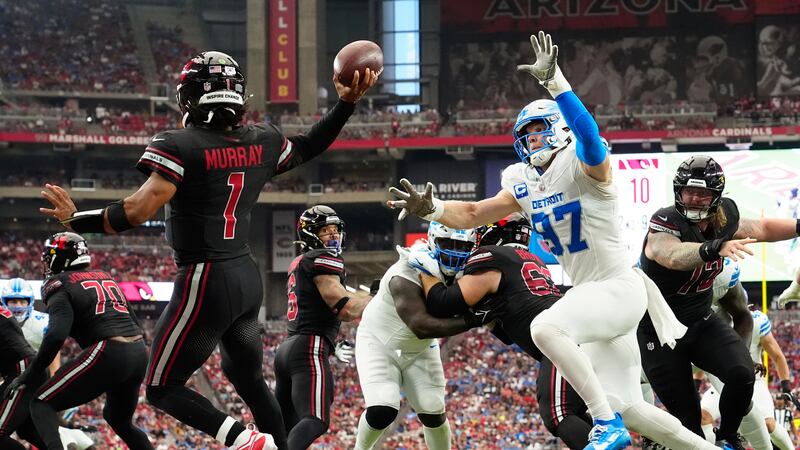 Detroit Lions defensive end Aidan Hutchinson (97) applies pressure to Arizona Cardinals...