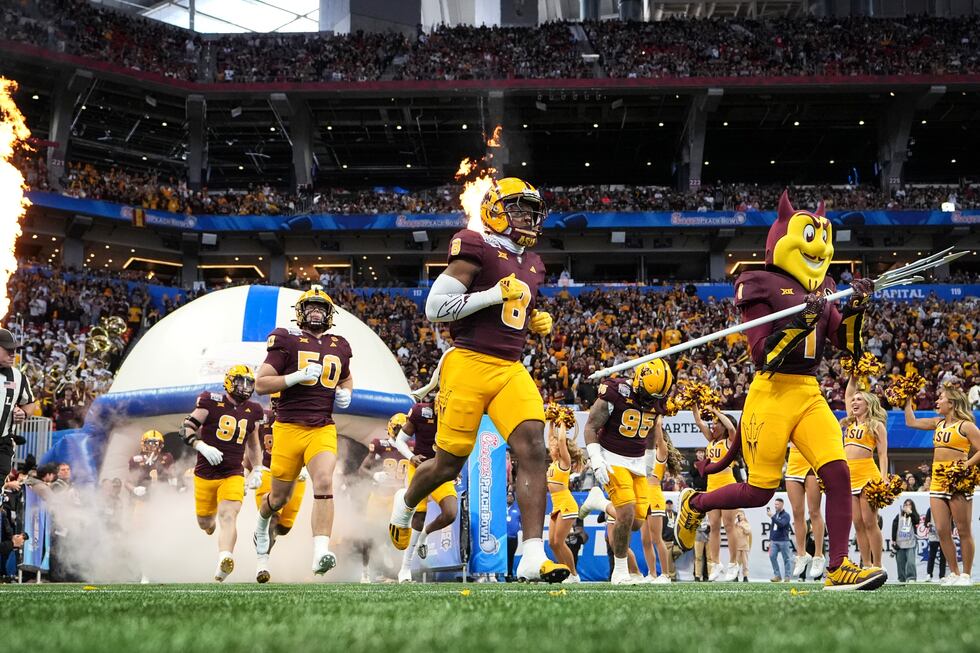 Arizona State players take the field before the first half in the quarterfinals of a College...