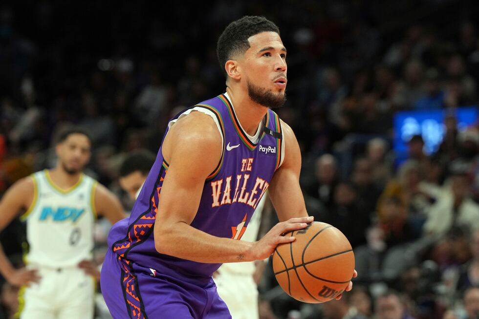 Phoenix Suns guard Devin Booker (1) during the first half of an NBA basketball game against...