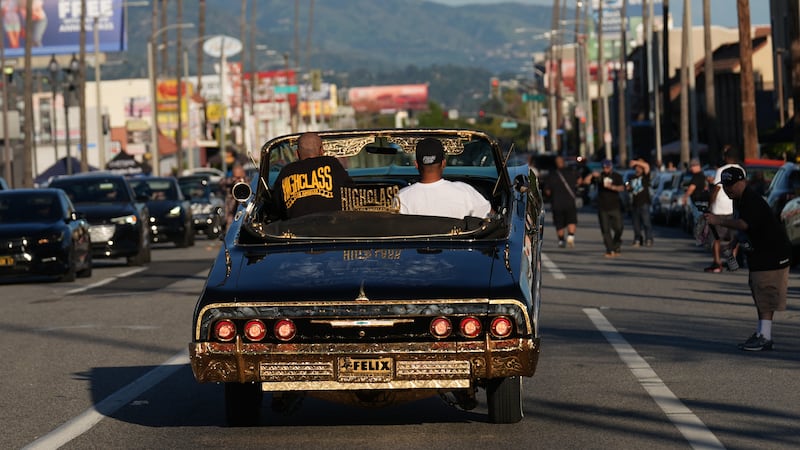 Lowriders cruise at the 6th Annual Lady Lowrider Cruise Night in celebration of International...