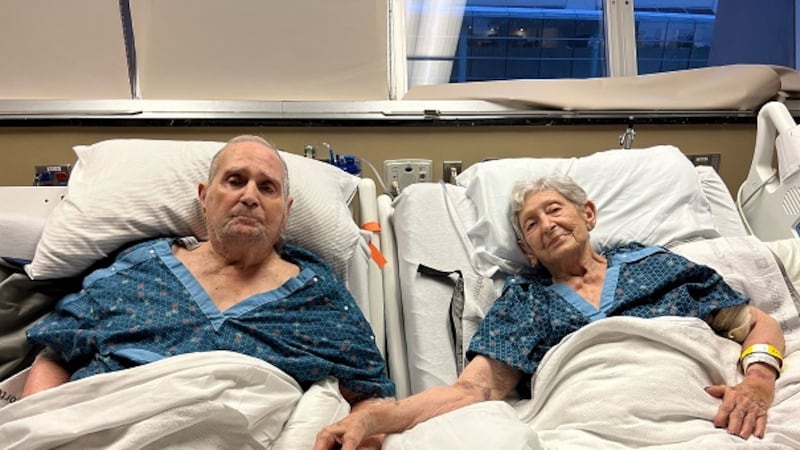 Virginia and Tommy Stevens hold hands at Vanderbilt University Medical Center.