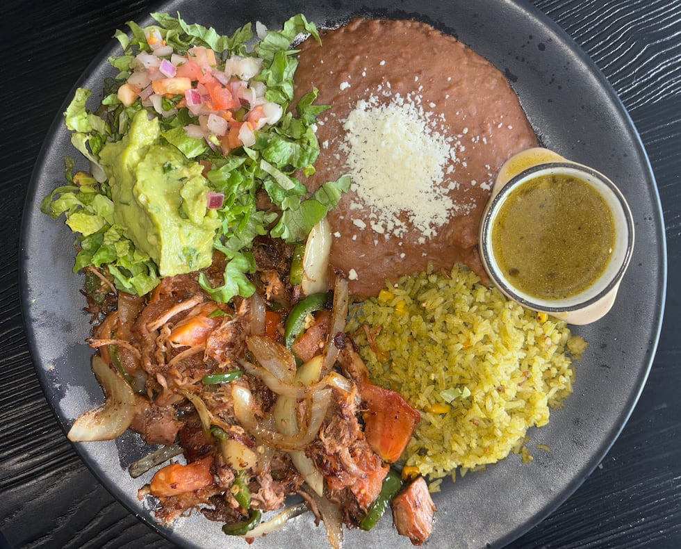 The pork carnitas come with slow-roasted pork with orange and herbs, caramelized jalapeño,...