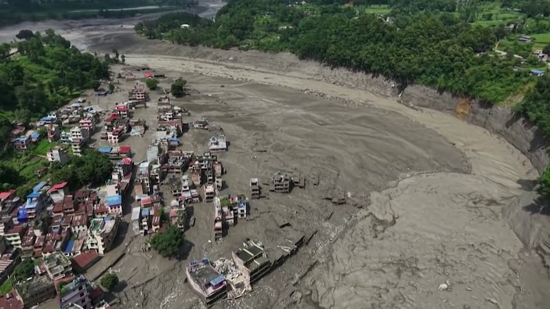 A new lake formed by a landslide poses a further threat.