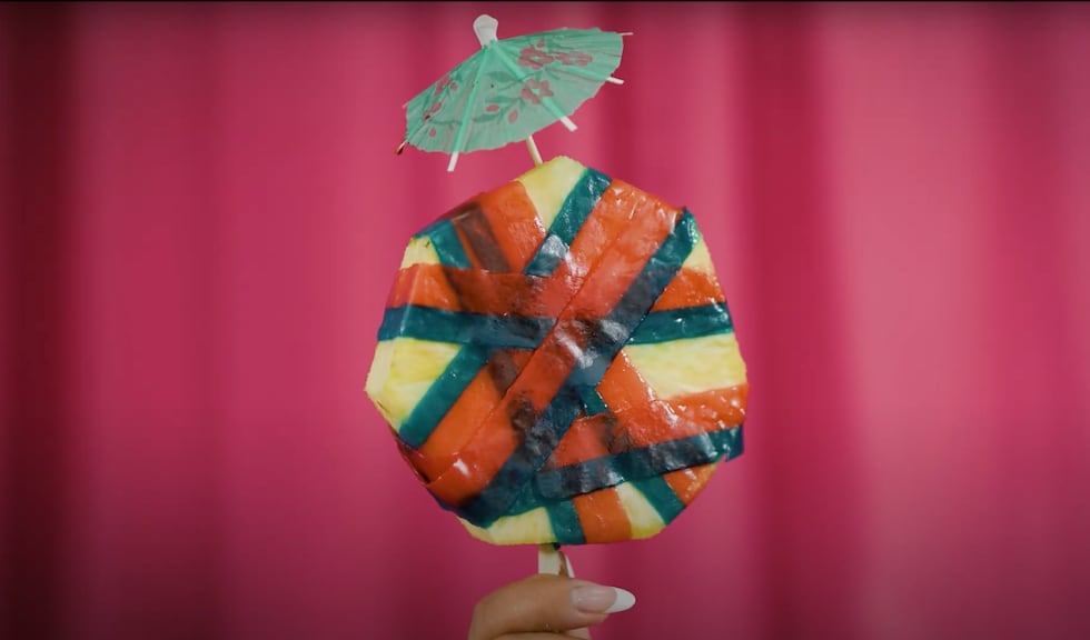 Candied Pineapple is a chunk of fruit wrapped in fruit rolls and topped with chamoy and Tajín....