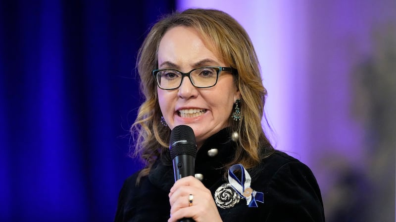 FILE - Former Arizona Rep. Gabby Giffords talks during a vigil remembering the 25th...