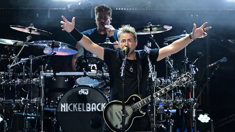 Chad Kroeger, front, of Nickelback, performs during a concert Sunday, Aug. 3, 2025, at the Pro...