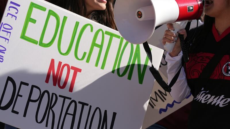 FILE - Students march at Arizona State University in protest of ASU's chapter of College...
