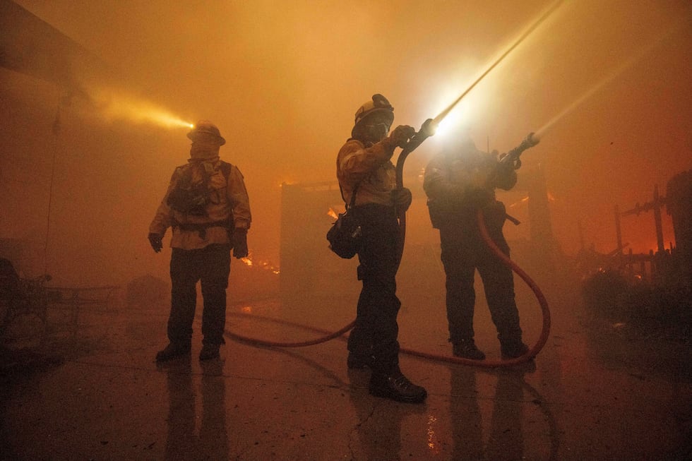 Fire crews battle the Eaton Fire Wednesday, Jan. 8, 2025 in Altadena, Calif.