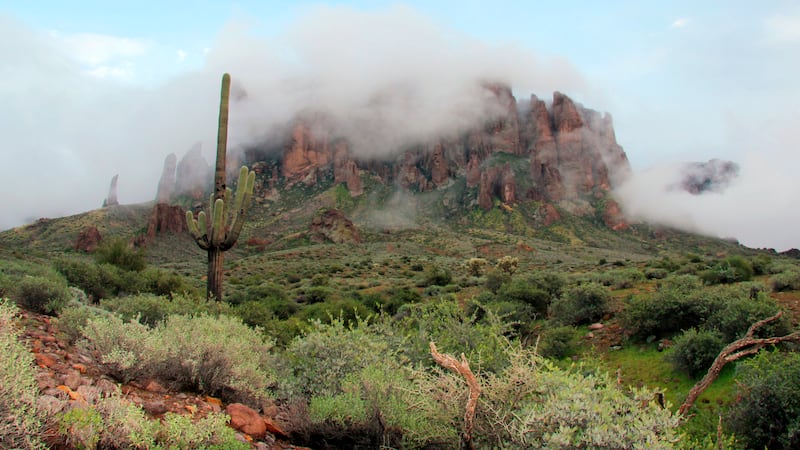 FILE - In this Jan. 29, 2015 file photo, low-hanging winter clouds hug part of Superstition...