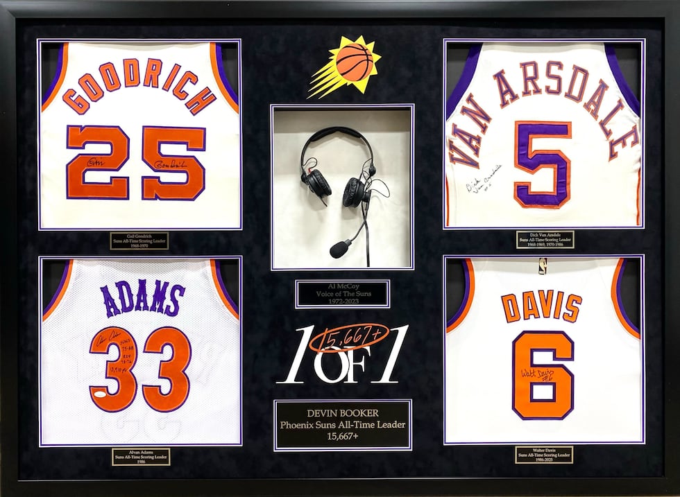 The Suns gave Booker a frame of four signed jerseys and a headset.