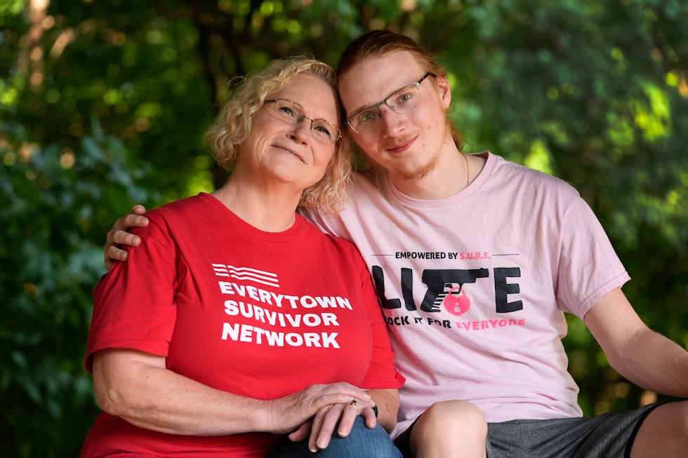 Denise Wieck and her son Guy Boyd,who was shot in the eye with a ghost gun, pose in Ypsilanti,...