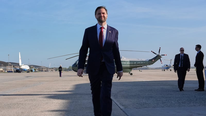Vice President JD Vance walks to speak with the Press before boarding Air Force Two, Friday,...