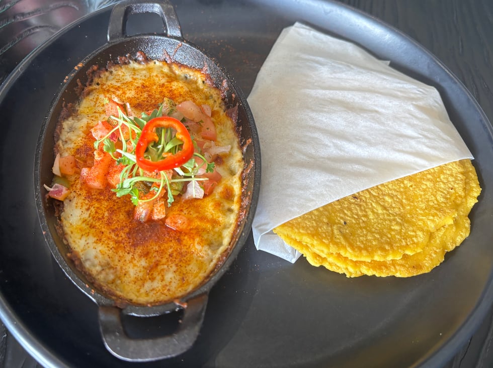 The queso fundido is made with chorizo and served with homemade, gluten-free corn tortillas.