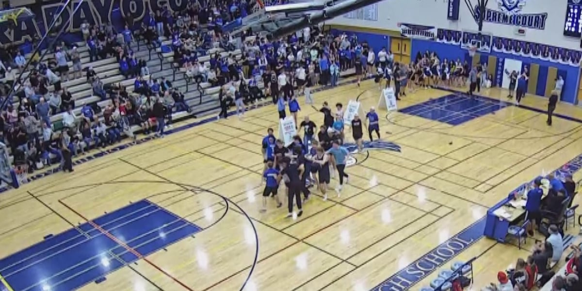 Fans rush court after Phoenix special needs student makes half court shot Fans rush court after Phoenix special needs student makes half court shot