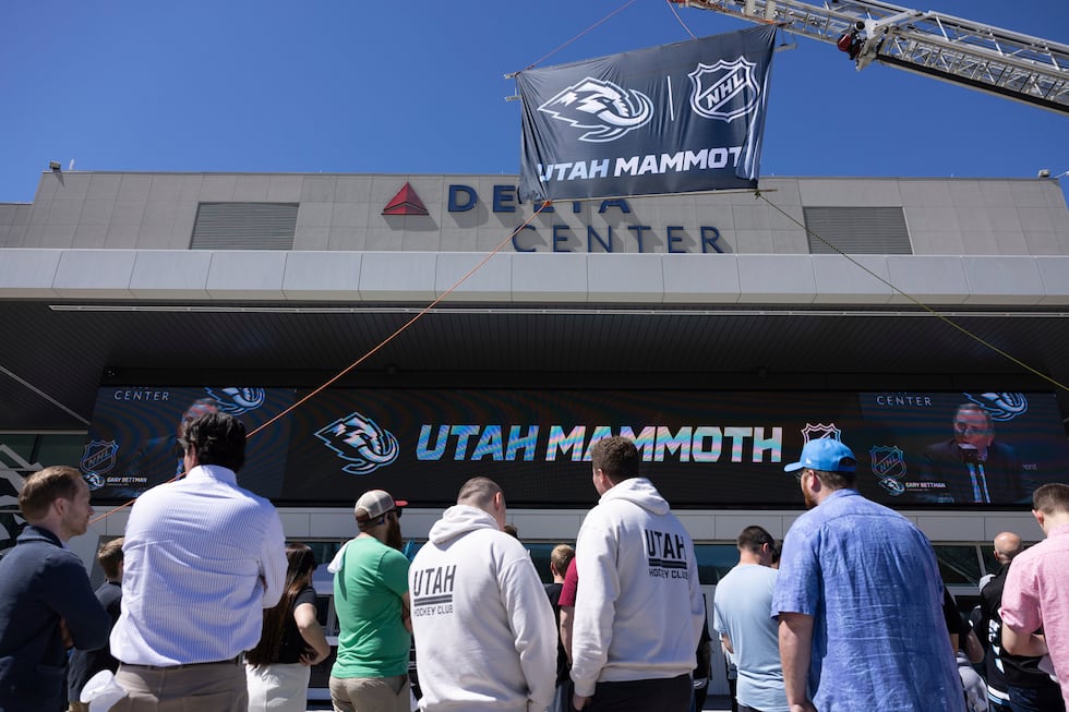 Fans watch outside Delta Center watch the live press conference announcing Utah Mammoth as the...
