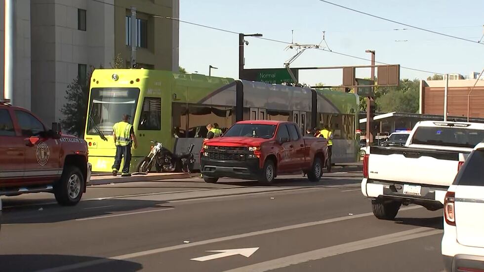 Police respond to a crash involving a motorcycle and a light rail car in Tempe.