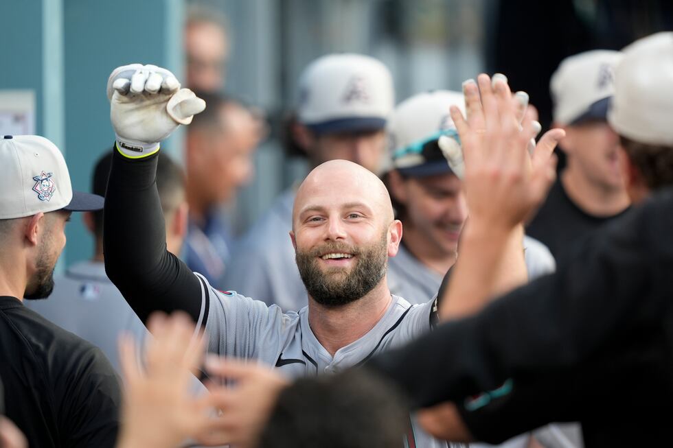 Arizona Diamondbacks' Christian Walker celebrates after his two-run home run during the third...