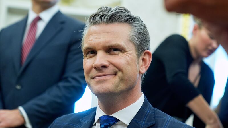 Secretary of Defense Pete Hegseth listens as President Donald Trump meets with Norwegian Prime...