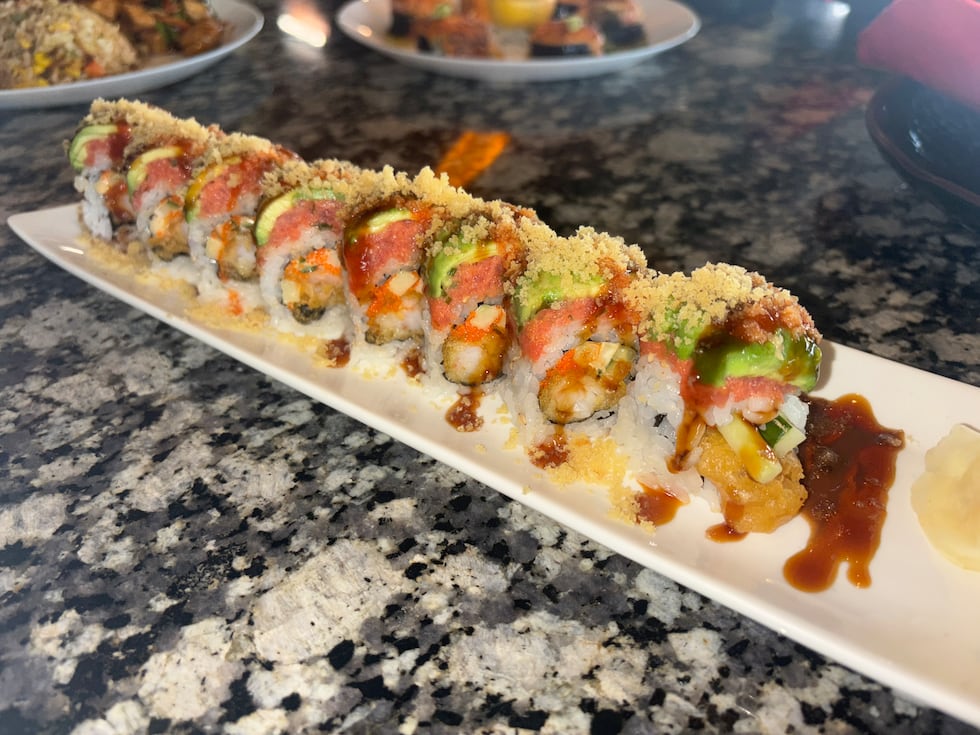 The Point Break Roll is a shrimp tempura roll topped with spicy tuna, avocado, eel sauce,...
