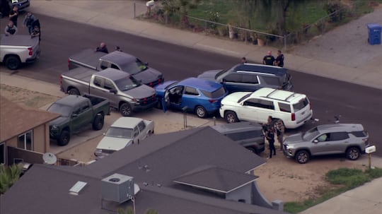 Aerial video showed undercover officers boxing in a blue SUV after a police shooting in...