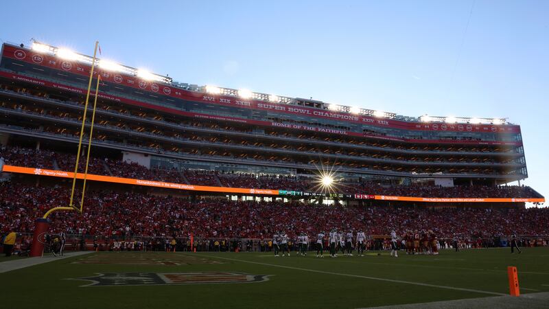 Fans at Levi's Stadium watch during the first half of an NFL football game between the San...