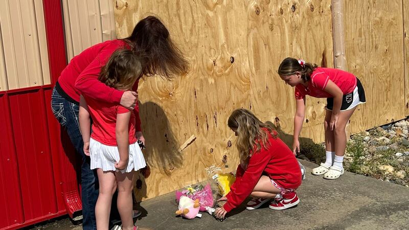 Jennifer Walston, 43, hugs daughter Lexi Walston, 6, while sisters Briley Walston, 9 and...