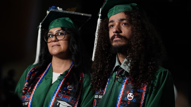 A mother and son recently graduated together.