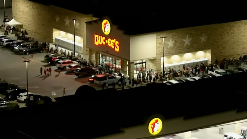 A long line of fans lined up outside the new Texas-sized gas station near Interstate 10 and...