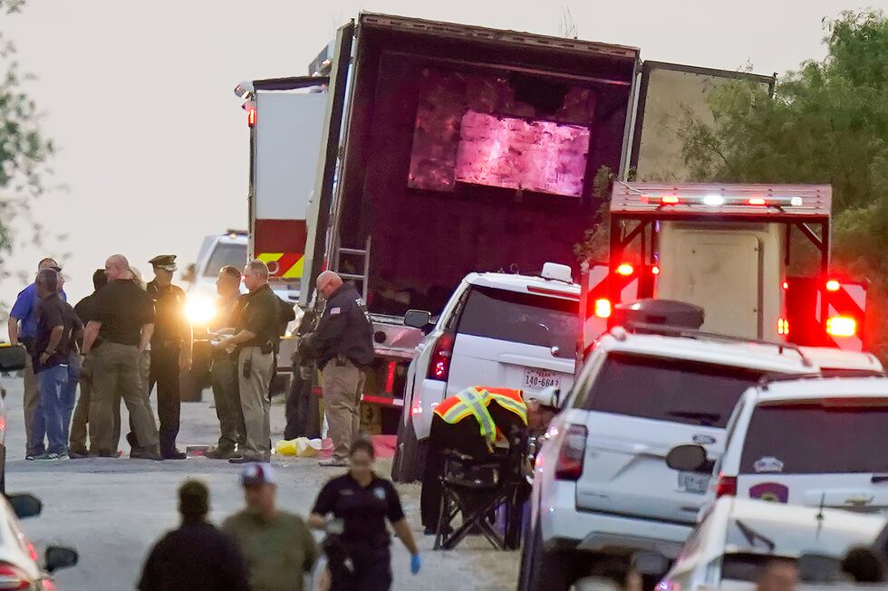Police and other first responders work the scene where officials say dozens of people have...