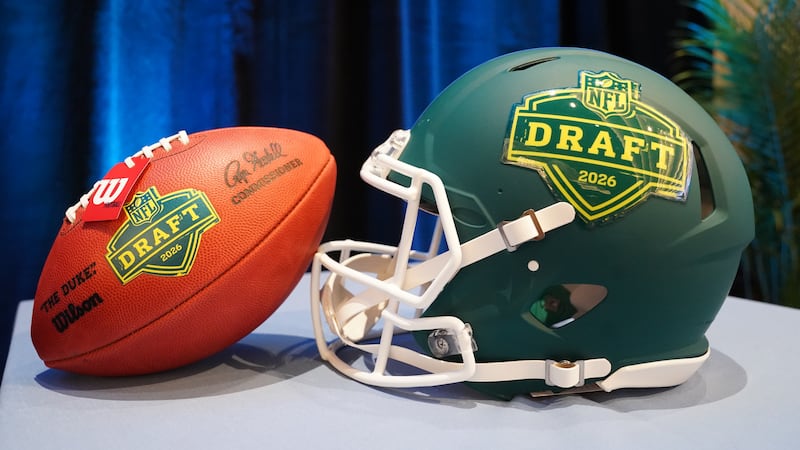 Football helmet and ball during the Prospect to Pro Family Panel event ahead of the NFL draft...