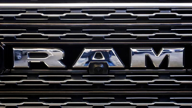 FILE - This Feb. 14, 2019, file photo shows the Ram logo on the front grill of a Ram 1500 at...