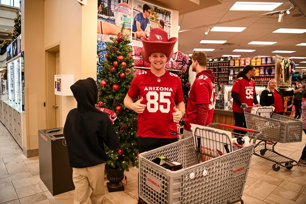 Arizona Cardinals tight end Trey McBride (85) hosts a “Catch for the Holidays” shopping spree...