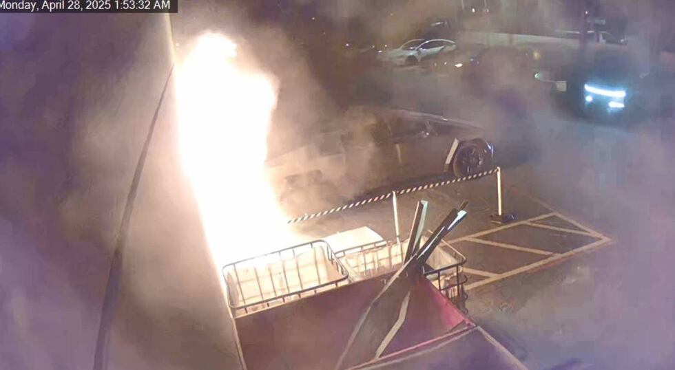 Surveillance cameras captured the fire that was set at a Tesla dealership in Mesa.