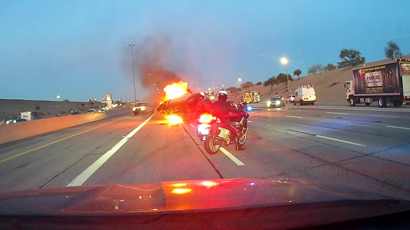 A Chandler police officer and a Peoria firefighter/paramedic saved a woman from a burning...