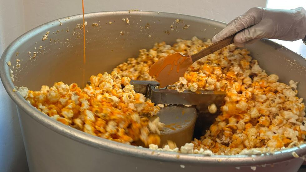 The popcorn goes from the popper to the tumbler, where it spins while the flavor such as real...