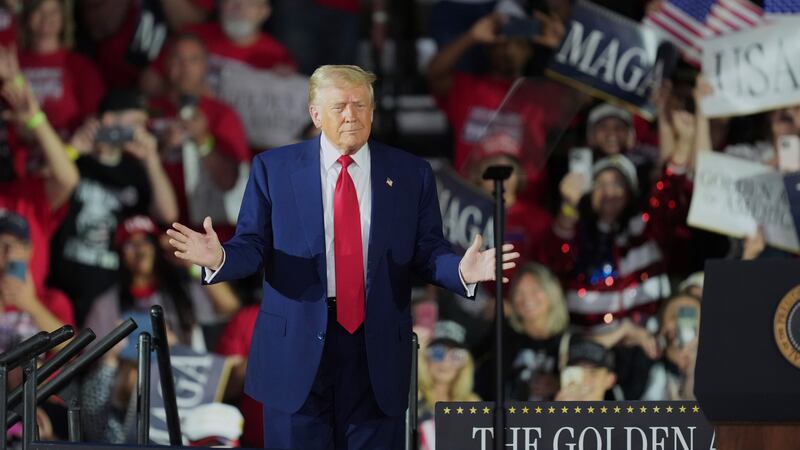 President Donald Trump arrives to speak on his first 100 days at Macomb County Community...