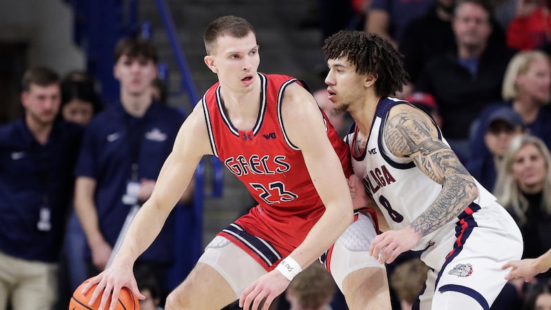 FILE - Saint Mary's forward Paulius Murauskas (23) controls the ball while pressured by...