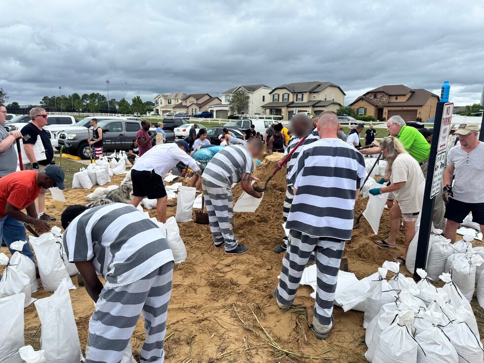 The inmates helped fill sandbags at three locations Tuesday, including PEAR Park, Minneola...