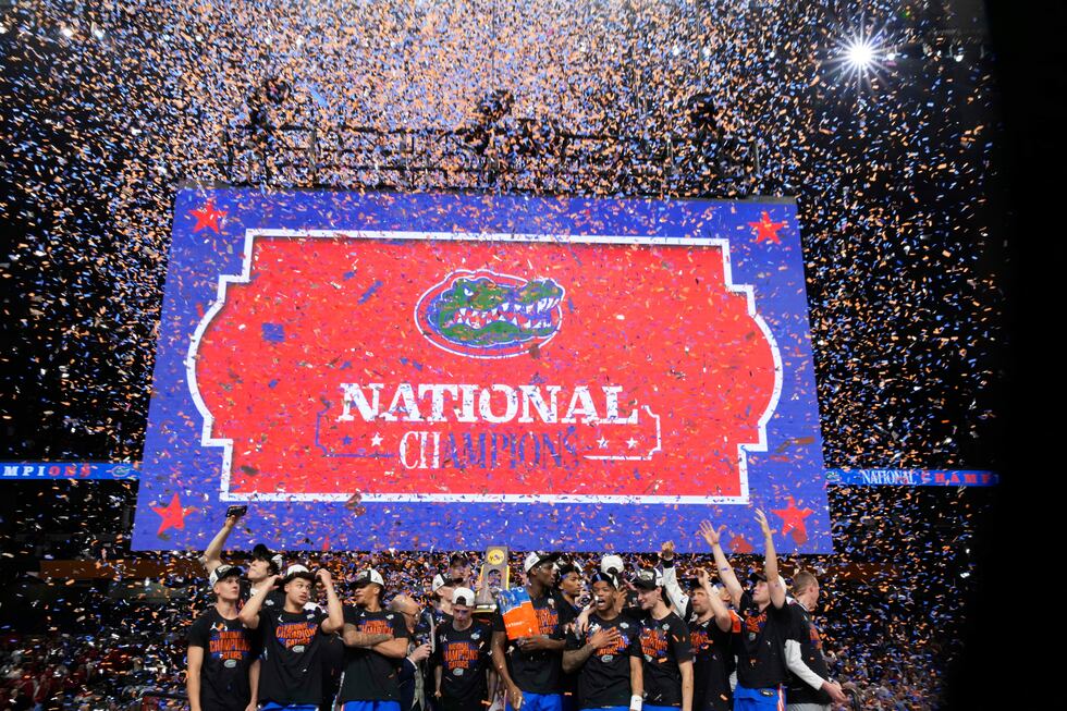 Florida celebrates with the trophy after their win against the Houston in the national...