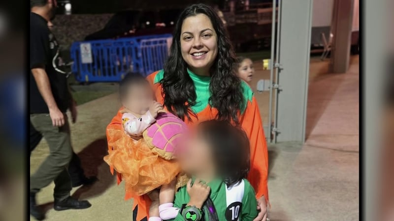 An Arizona mother is dead after being attacked by a group of dogs while trying to shield her...