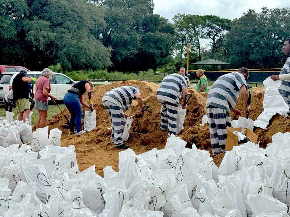 The inmates helped fill sandbags at three locations Tuesday, including PEAR Park, Minneola...