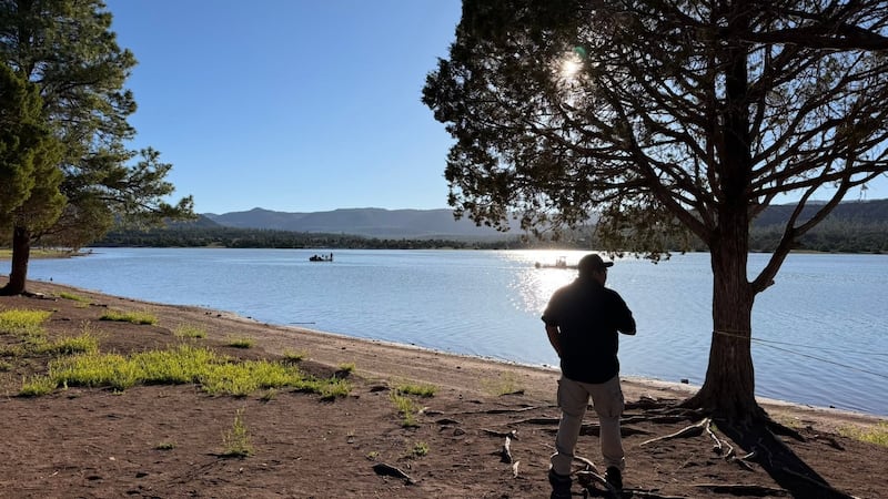 Authorities are searching for two missing people after their boat overturned on Wheatfields Lake.