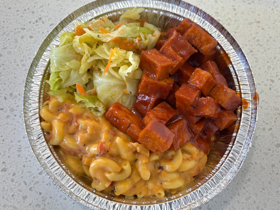 The Jerk BBQ Tofu Entree with cabbage, mac and cheese. All ingredients in this dish are vegan.