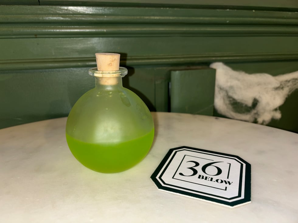 The Wildfire is a martini made with melon liqueur, vodka, lemon juice. It's smoked, corked,...
