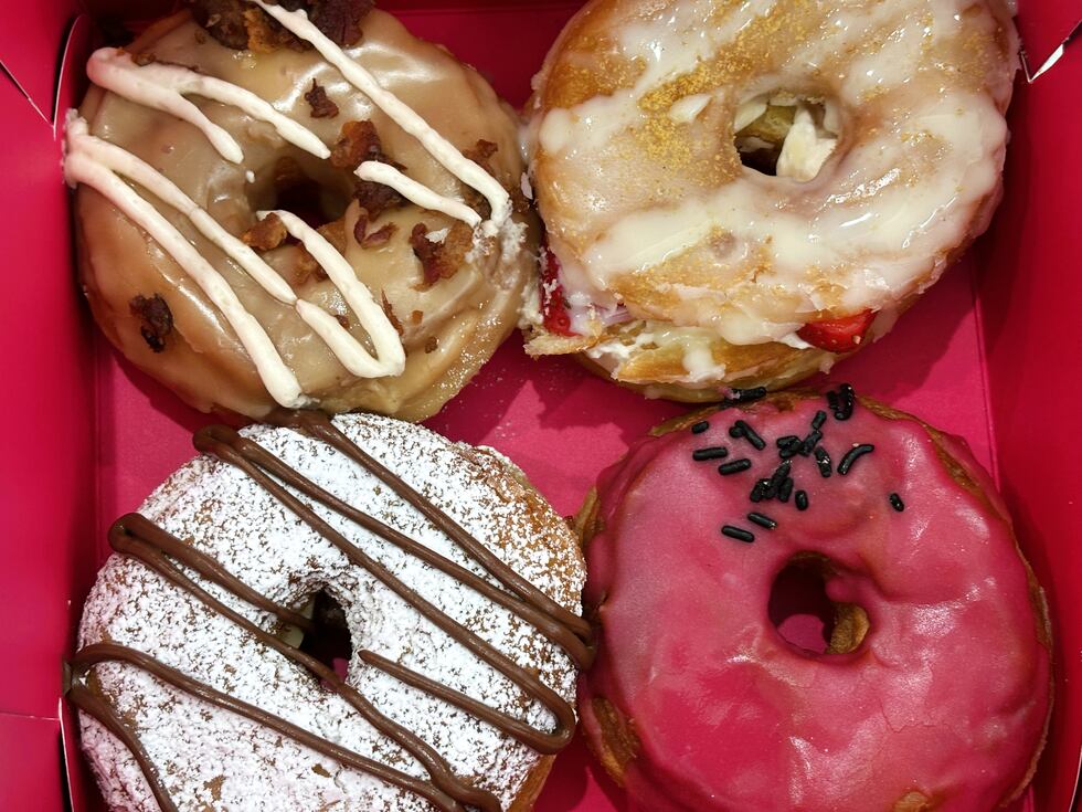 Outcast Doughnuts serves over a dozen flavors of croissant-style doughnuts. This box has The...