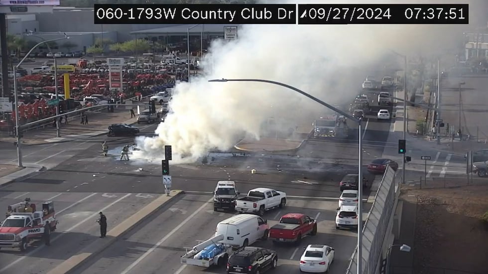 Firefighters respond to a crash with vehicles engulfed in flames on Friday morning in Mesa.